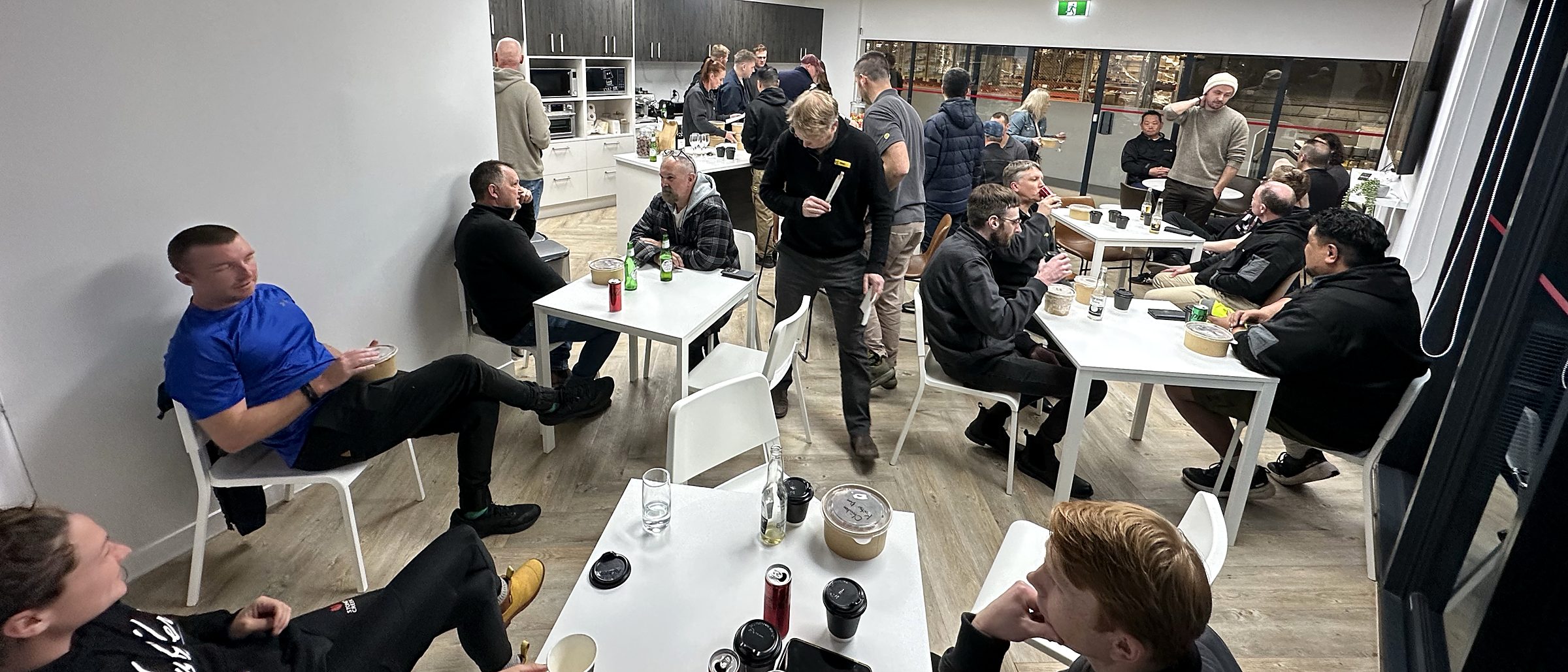 The Silk Lane Group team talking over coffee in the staff room at the end of the day